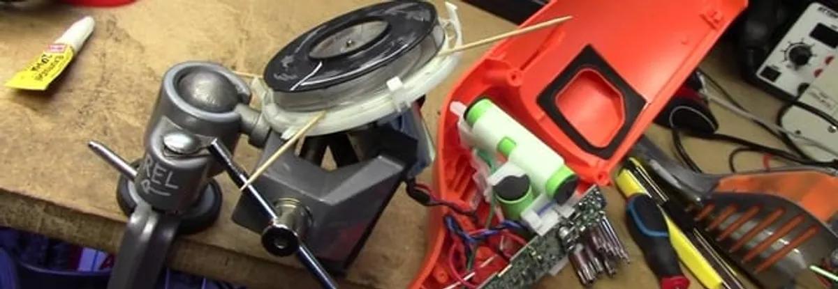 Vacuum cleaner repair parts and tools on a workbench in Cleveland, OH